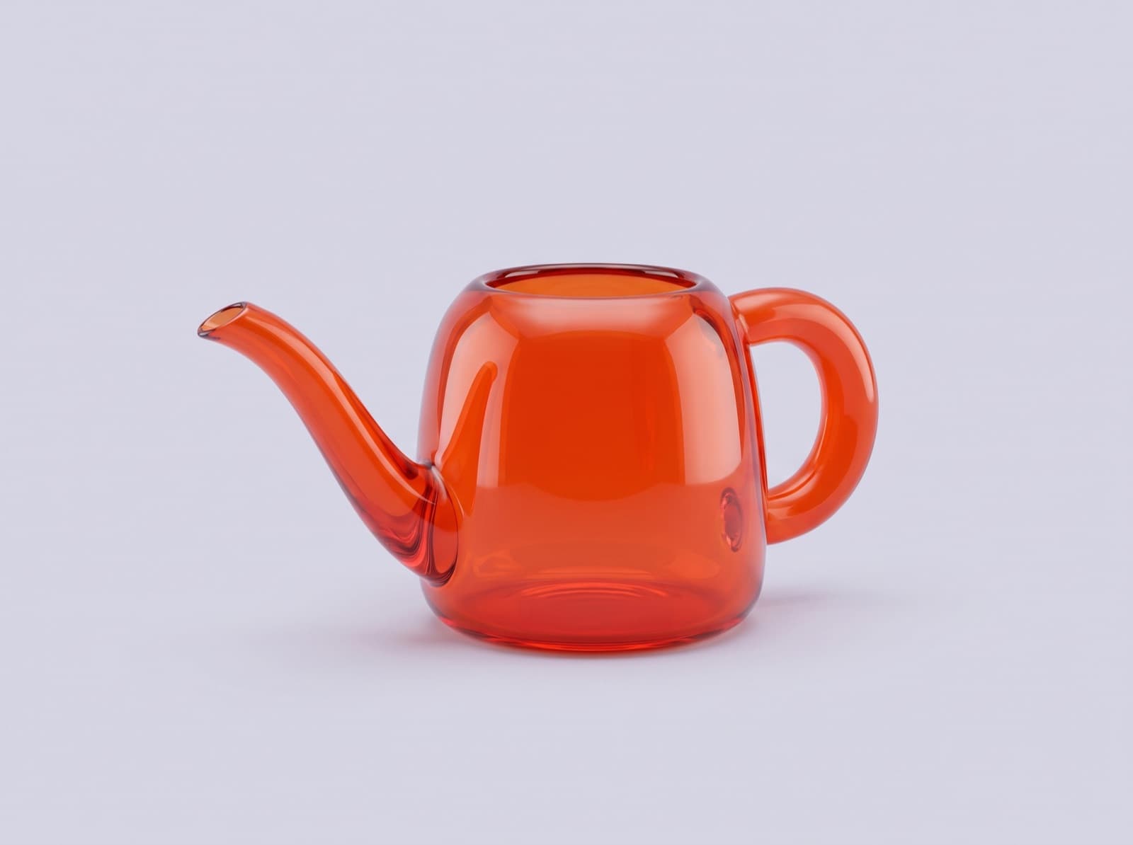 A small watering can sculpted in glossy orange glass on a lavender grey background